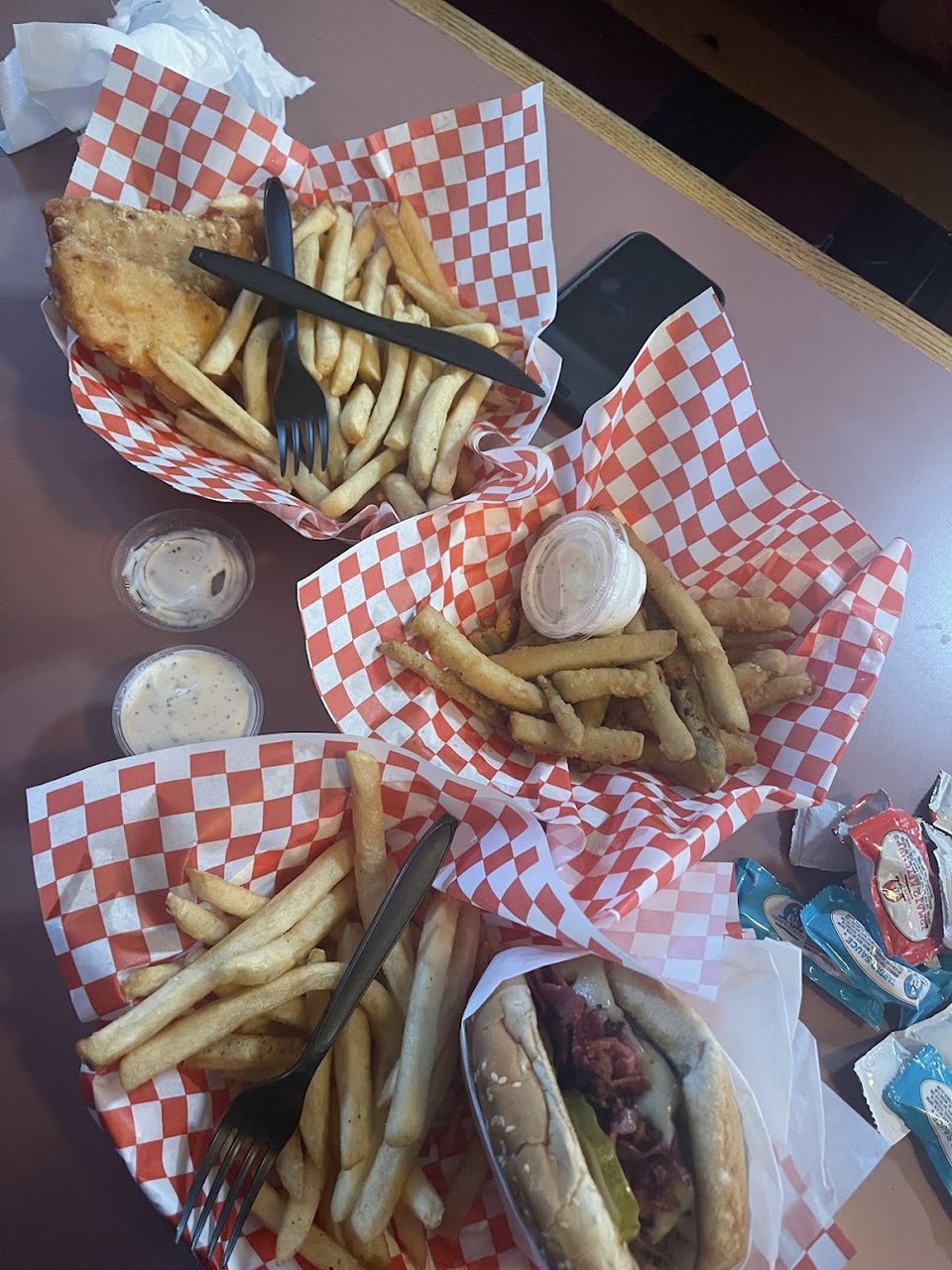 Printed menu page with breakfast and burger sections.
